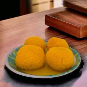 Close-up of beautifully garnished rajbhog hd images sweets with saffron, pistachio, and almond slivers. rajbhog hd images rajbhog mithai image rajbhog picture