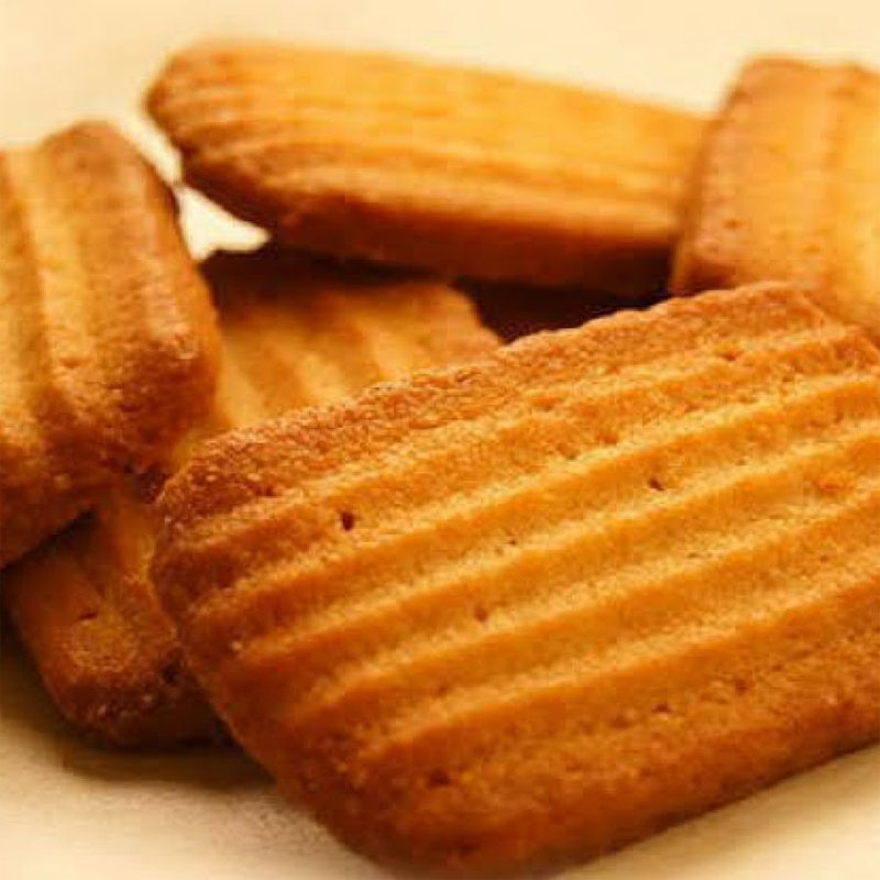 Golden brown cookies with saffron infusion, arranged on a plate, ready to delight your taste buds.