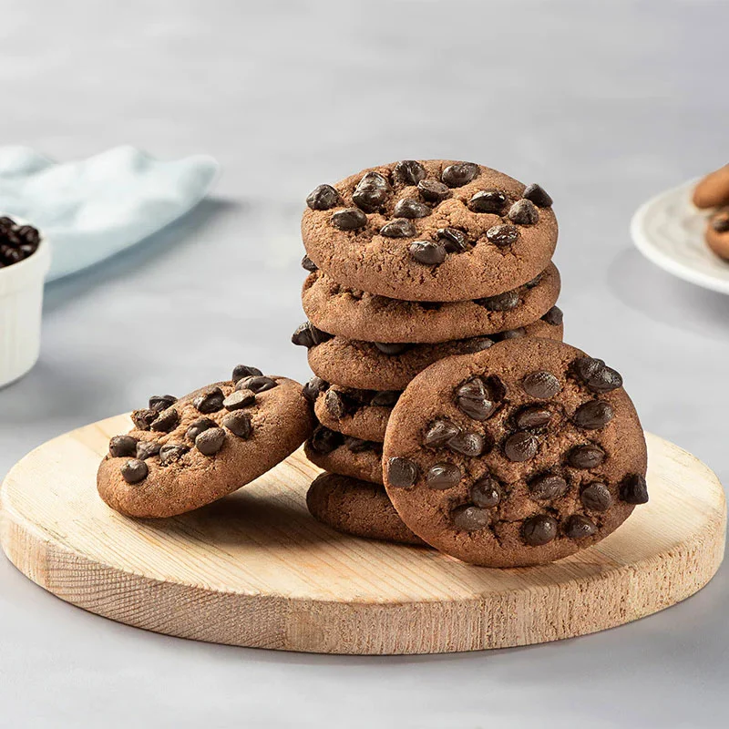 Stack of chocolate cookies with gooey chocolate chunks.