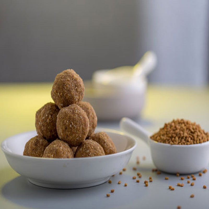 Image of Methi Laddu - A traditional Indian sweet made with fenugreek seeds, jaggery, and nuts.
